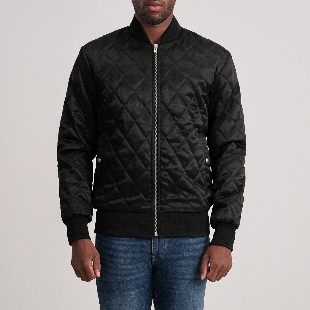 Danson Quilted Black Varsity Jacket in Black Satin - Front Profile View &amp; Tailored Silhouette | Buy Online