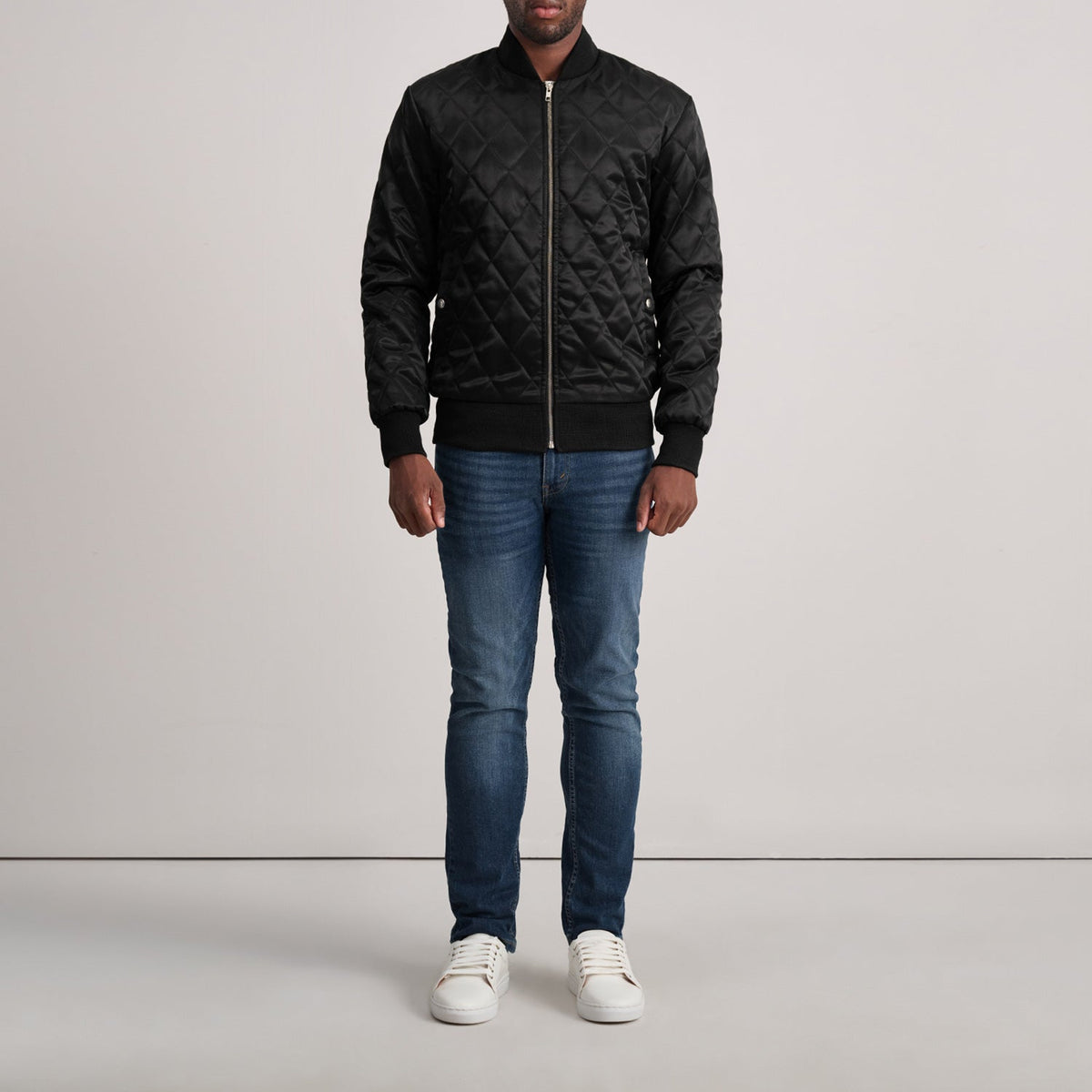 Close-Up Detail of Varsity &amp; Zipper Hardware on Danson Quilted Black Varsity Jacket