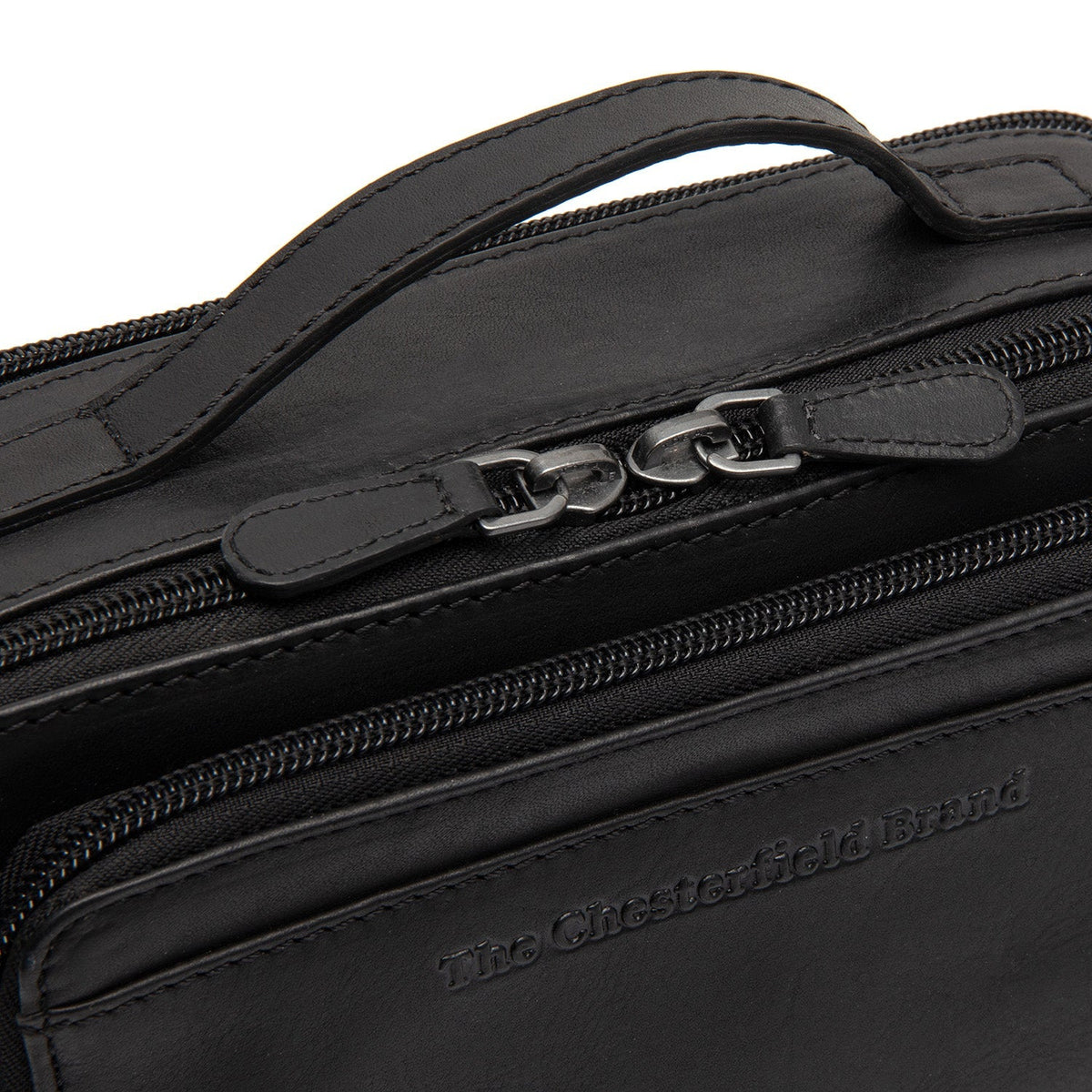 
Solid Antique Brass Hardware & Heavy-Duty Dual Zipper Detail on Rovon ტყავის ჩანთა კროსბოდი